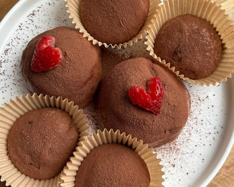 Chewy dubai chocolate cookie sliced to reveal pistachio kataifi and strawberry inside